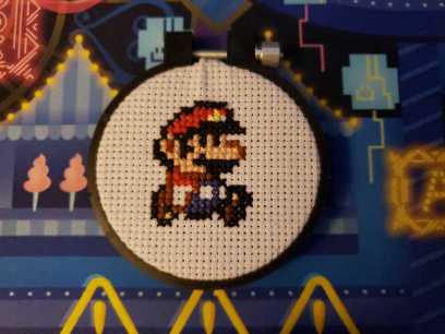 Front of Super Mario World cross-stitch.